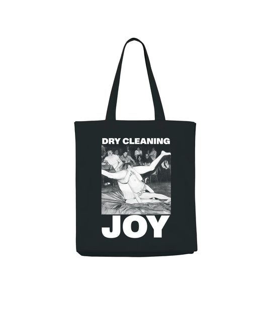 Black tote bag with 'Dry Cleaning Joy' text 